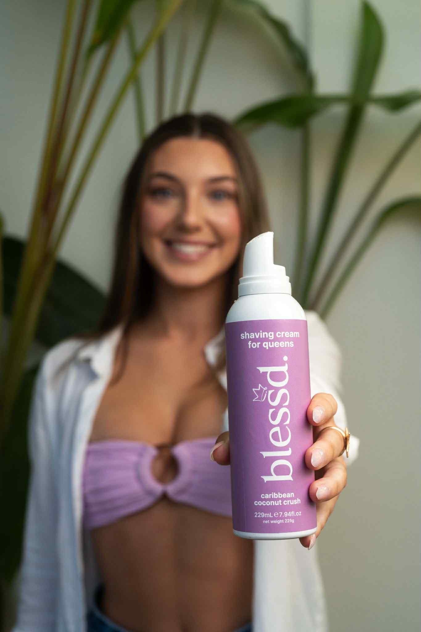 Woman holding women's shaving cream